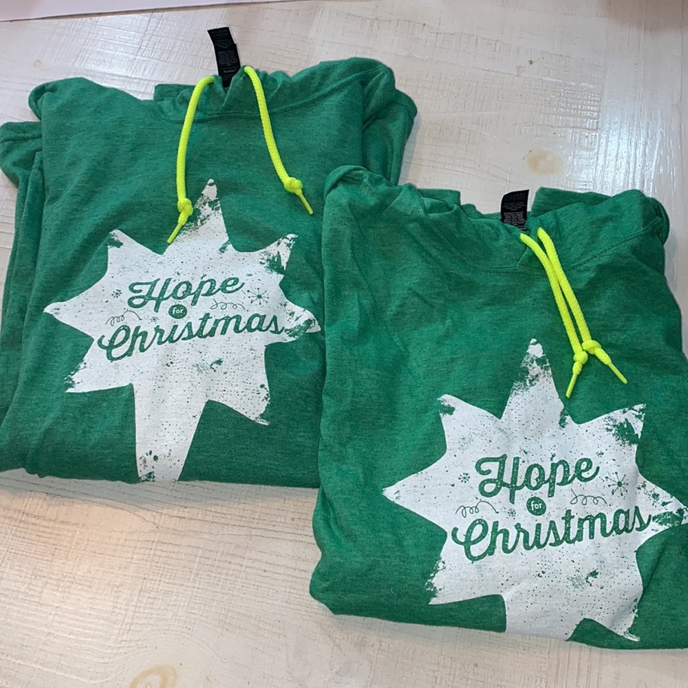 Pair of Hope for Christmas Anvil green hoodies - one Large & one Medium